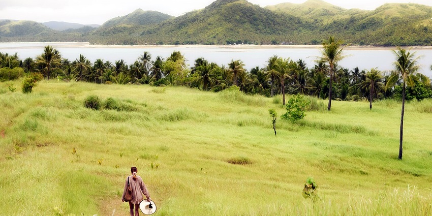 Corregidor Island with green palm trees, one of the historical places of Philippines.