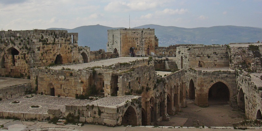 Crac des Chevaliers with old ruined architecture, multiple gates, one of the historical places in Syria.