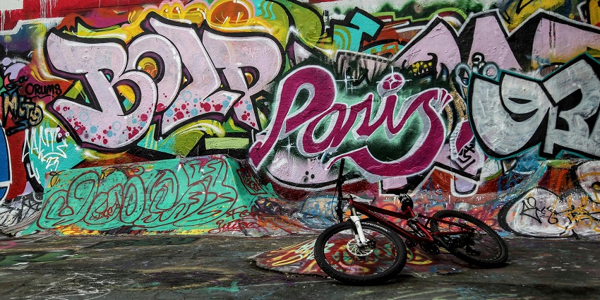 Colorful street art murals painted on an urban wall