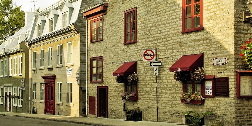Charming Quebec City street with historic buildings and peaceful atmosphere, showing what is the safest city in Canada.