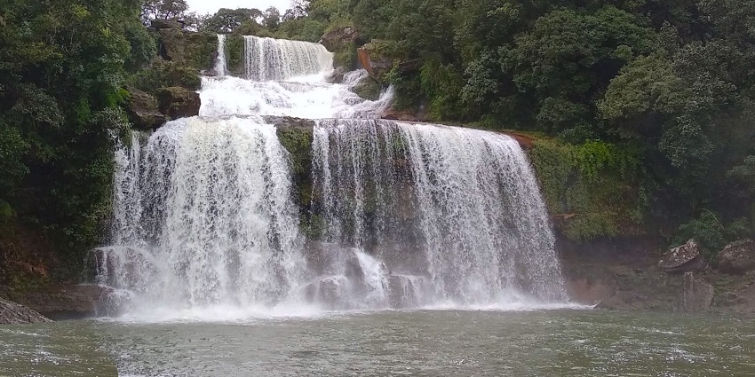 Crinoline Falls And Pool flowing into a water body, one of the best places to visit in Shillong in July.