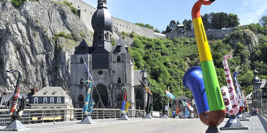 Enjoy the artistic bridge lined with colourful saxophone sculptures, one of the most interesting things to do in Dinant.