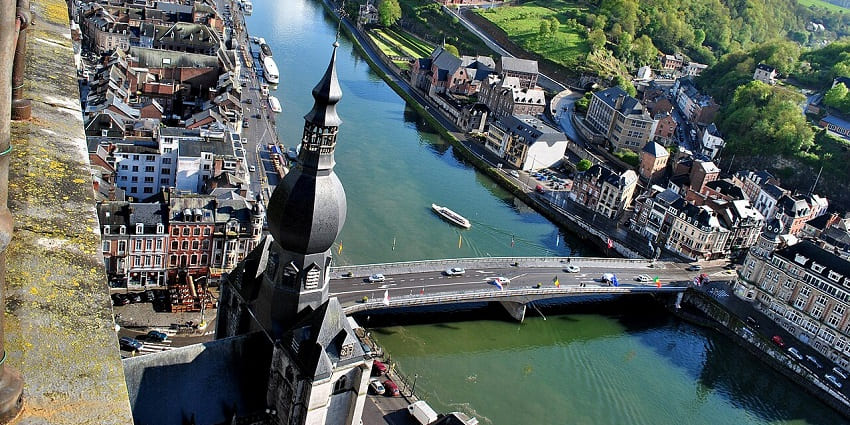 Sightseeing and a boat tour along the Meuse River with cliffs and town views, one of the top things to do in Dinant.
