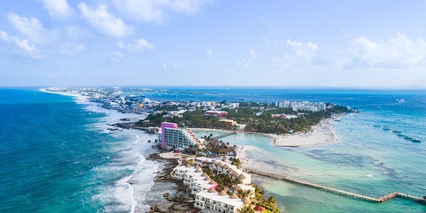 Relax on pristine beaches and enjoy beachside dining on the island of Isla Mujeres.