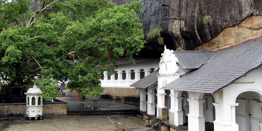 The Dambulla Cave Temple interior showing ancient Buddha statues, one of the top monuments in Sri Lanka.