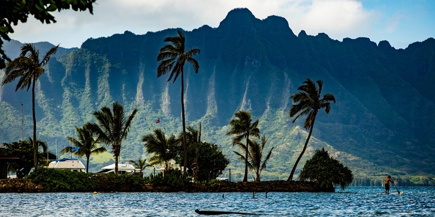 Kaneohe Bay in Oahu with turquoise waters, coral reefs, and lush green shorelines.