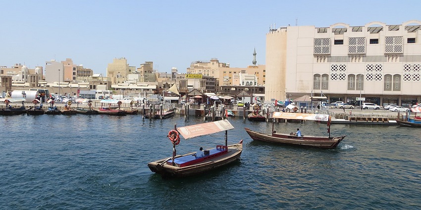 Scenic image of the Deira boat riding amidst the city of Dubai