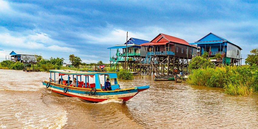 Image of the Tonle sap lake in Cambodia during the season of rains with a boat over it