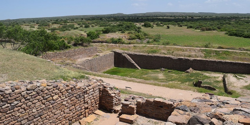 Ruins of the Indus Valley Civilisation with excavated reservoirs, walls, and ancient settlement layout, among the top places to visit in Gujarat in November.