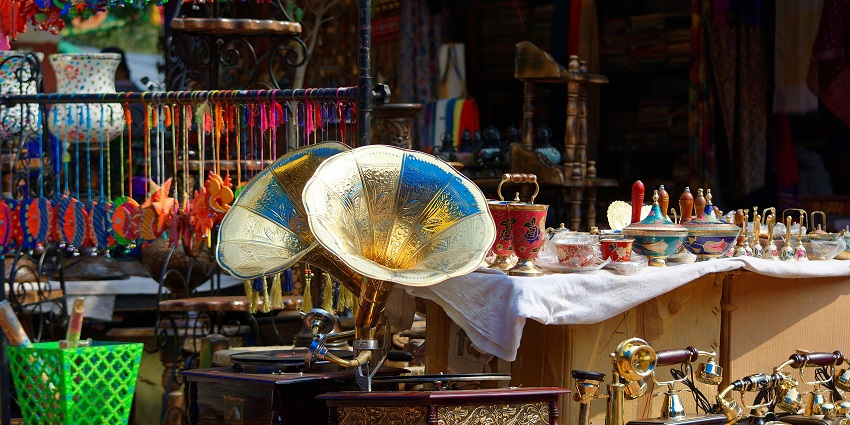 Dilli Haat INA with old gramophones and other traditional pieces in the shops, one of the places to visit in Delhi in October.