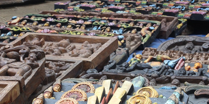 Image of handicraft items displayed at Dilli Haat, featuring traditional art and handmade products.