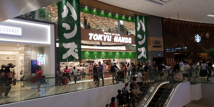 Tokyu Hands store featuring a modern storefront, bright sign, and neatly arranged merchandise displays.