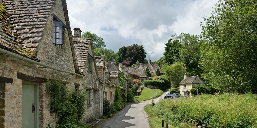 Things to do in the Cotswolds include exploring the historic stone cottages and serene waterscapes of this picture-perfect Cotswold village.