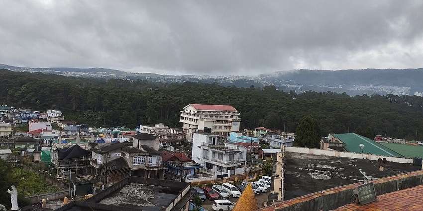 Don Bosco Museum in Shillong with distant buildings, dense green forests and mountains