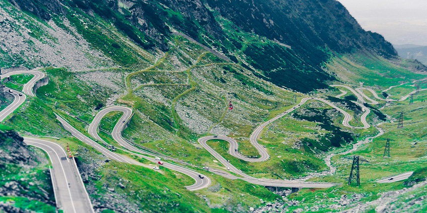 A must do in Romania include driving the scenic Transfagarasan Highway, winding through the Carpathians.