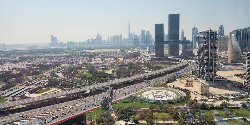 The Dubai Frame stands tall with a dense cityscape of modern buildings in the background.