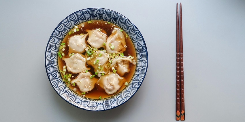 Soft, hand-shaped German dumplings served in a traditional style.