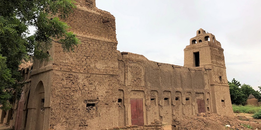 One of the mosques of the Tahoua region with sandstone architecture, small gates and trees