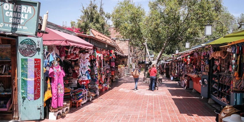 Olvera Street, with stalls and handmade items stalls on both sides, is one of the historical places in Los Angeles.