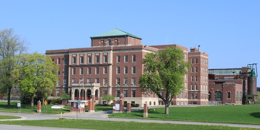 Eloise Asylum with red-themed architectural building, entrance gate.