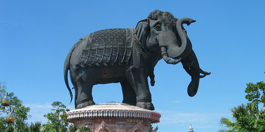 Erawan Museum with a huge elephant statue on a decorated structure against a blue sky.