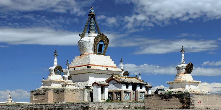 Zlota stupa in Erdene Zuu Monastery with traditional architecture, old walls and green grass