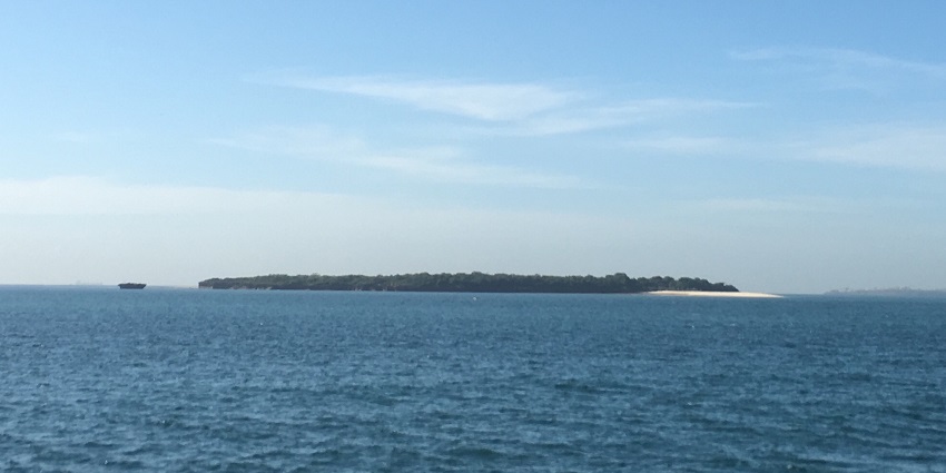 Clear turquoise waters lapping against white sandy shores at Bongoyo Island showcase natural things to do in Dar es Salaam.