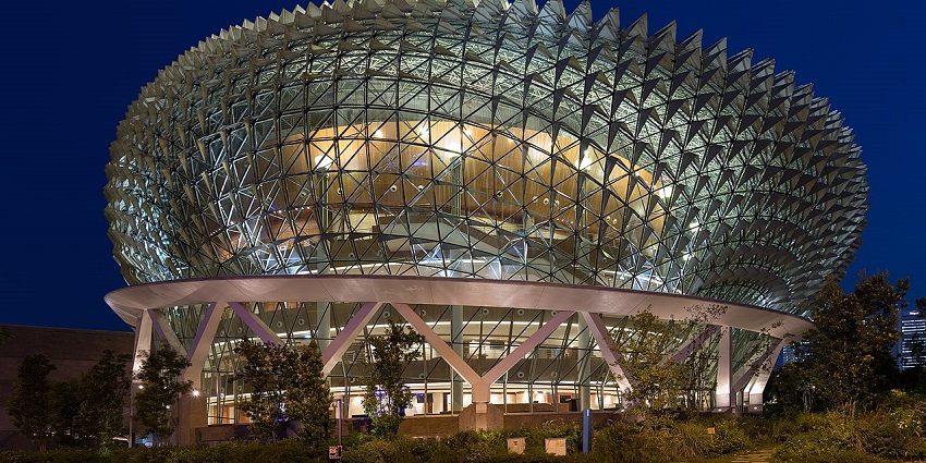 Esplanade Theatres on the Bay in Singapore is beautifully lit up during blue hour.
