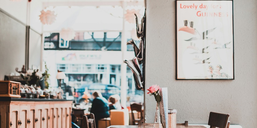 Cosy interior of Bluebird Café in Nashville with tables, chairs, and music decor.
