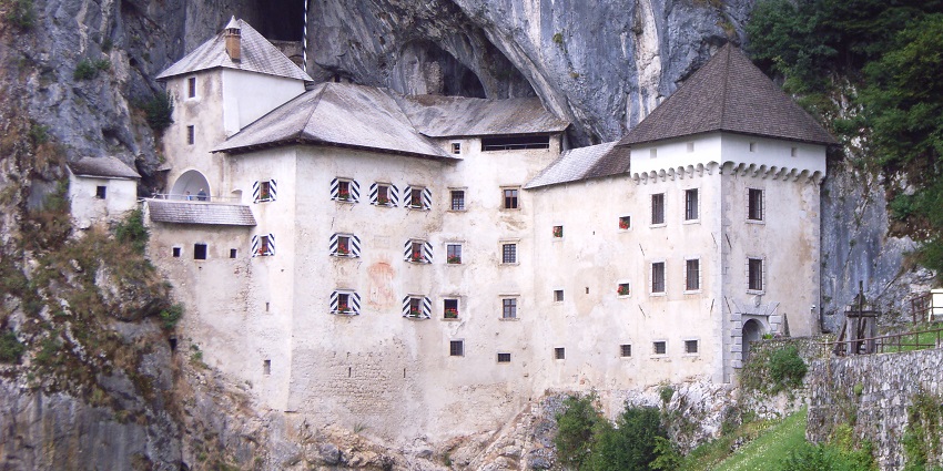 The 16th-century Predjama Castle, once home to a robber baron, secretly connects to distant fertile lands.