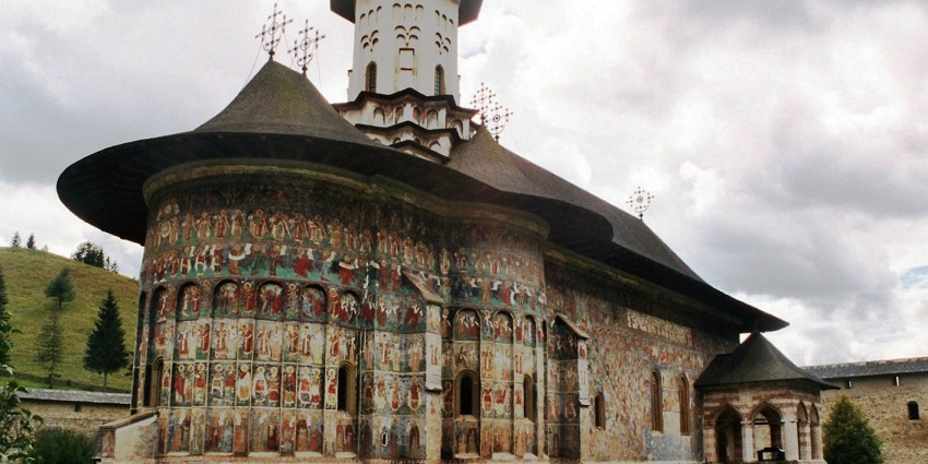 Things to do in Romania include exploring the vibrant frescoed monasteries in Bucovina, known for their artistry and historical depth.
