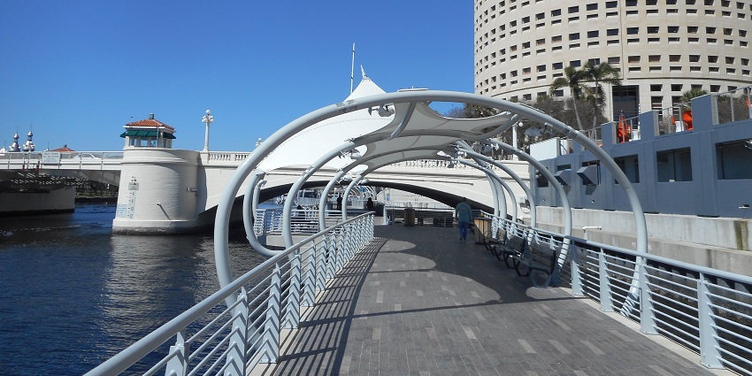 Enjoy a scenic walk along the Tampa Riverwalk, lined with waterfront views, among the best things to do in Tampa.