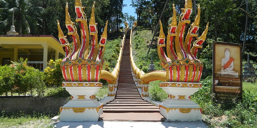 Buddhist temple surrounded by greenery, a spot among the top things to do in Koh Phangan.