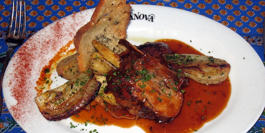 An image of Flæskesteg, roast pork with crackling, potatoes and gravy, a food in Denmark
