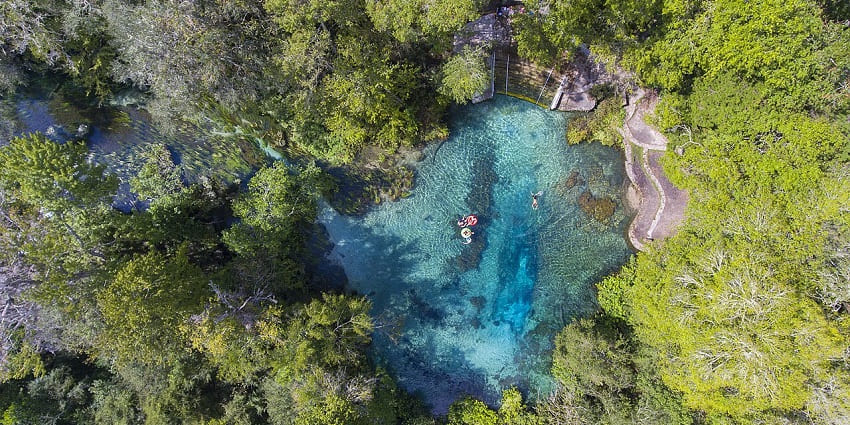 Top view of Crystal-clear waters and tubing fun at Ichetucknee Springs in Florida wilderness.
