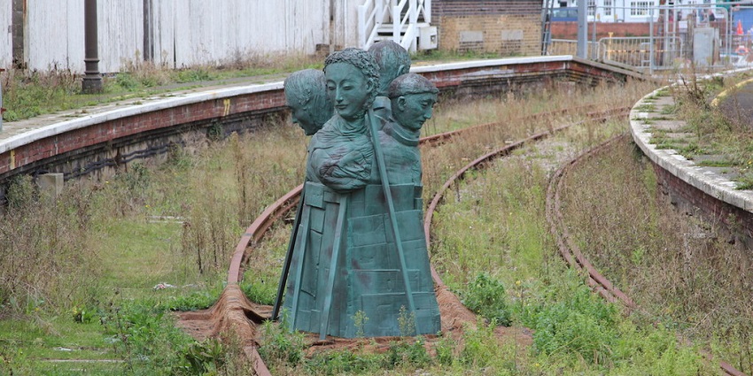 An image of an artwork sits on the disused railway at Folkestone Harbour railway station.
