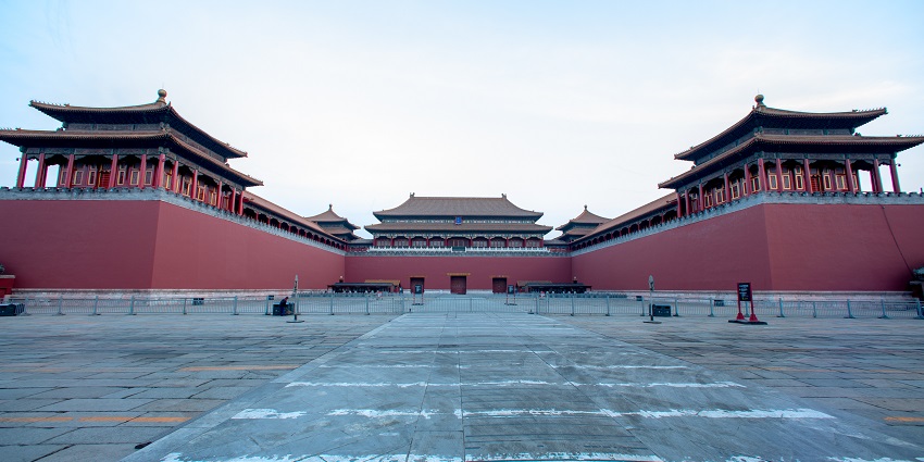 Meridian gate in forbidden city with traditional Chinese shrine, barricades and signage
