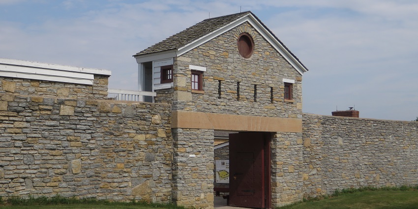 Entrance to the Fort Snelling with a rocky wall, brown entrance gate, one of the historical places in Minnesota.