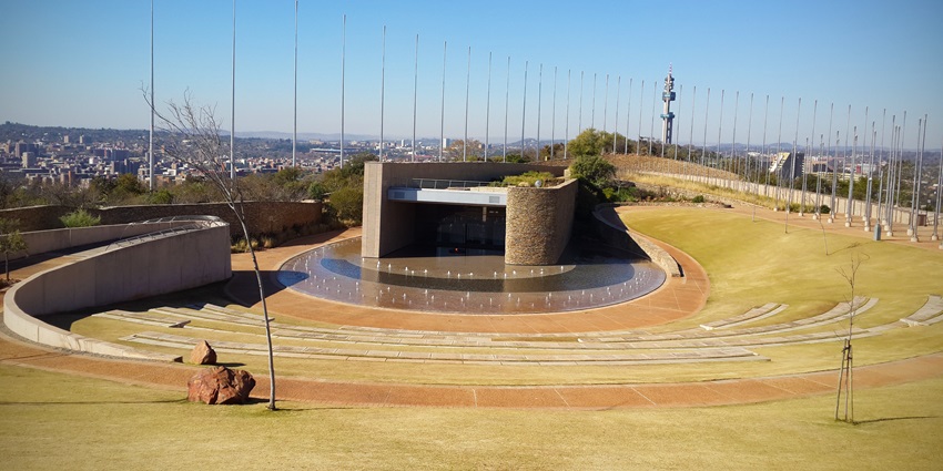 Circular architecture and towering pillars at the Freedom Park in South Africa.