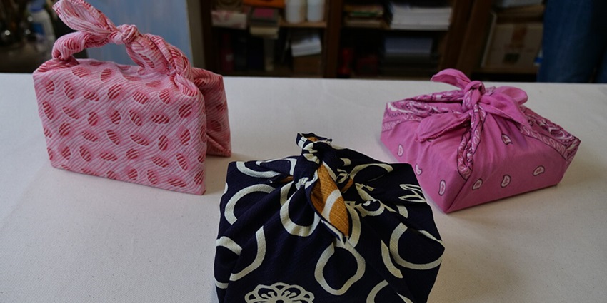 Patterned Furoshiki cloths folded neatly with traditional Japanese prints—eco-friendly things to buy in Tokyo.