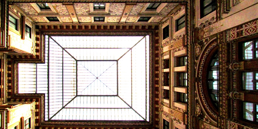 A breathtaking view of the intricately designed interiors of the Galleria Sciarra in Rome.