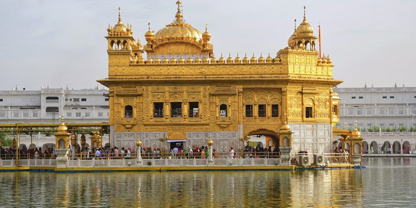 Majestic view of the Golden Temple shimmering in Amritsar's serene lake, among the best places to visit in Punjab in November.