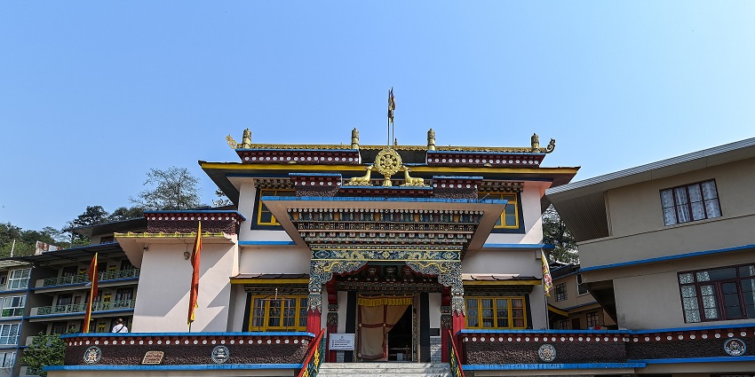 Outside view of Gonjang Monastery in Gangtok with paved ground, one of the top places to visit in Gangtok in April.