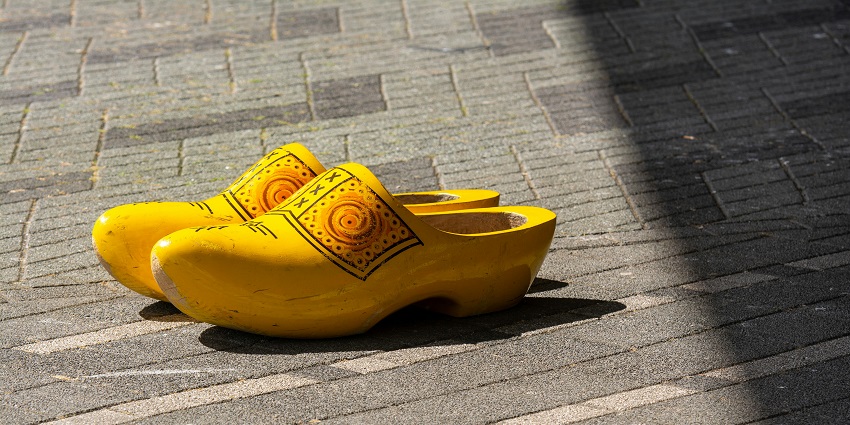 Colourful hand-painted wooden clogs, a quirky and classic Dutch souvenir, one of the top things to buy in Netherlands.