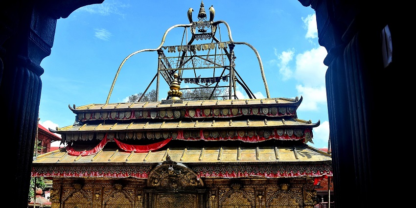 Guhyeshwari Temple's front view is adorned with intricate carvings and sacred decorations.