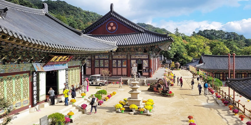 Haeinsa temple with traditional Korean architectural buildings of temple and people visiting
