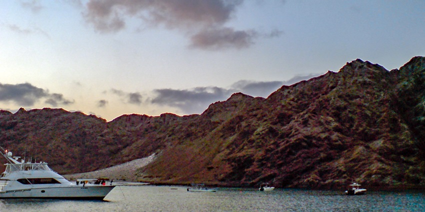 Rugged cliffs and pristine, untouched beaches across the Hallaniyat Islands in Oman.
