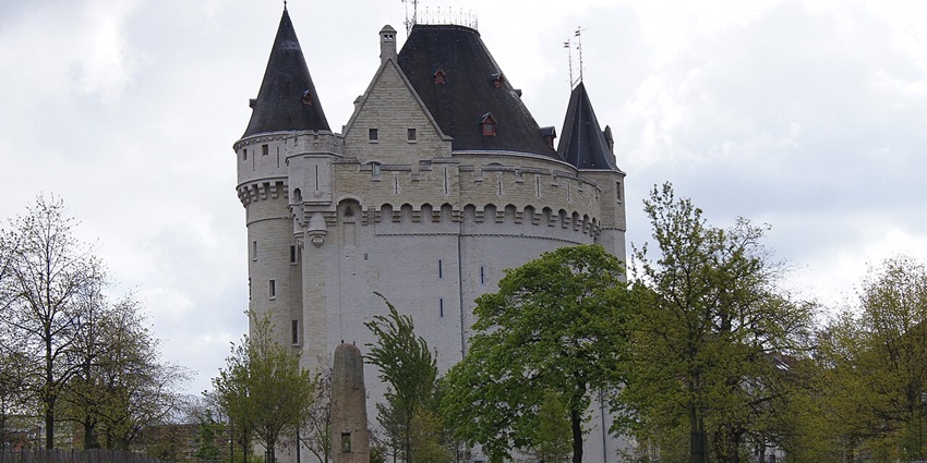 Halle Gate with traditional Christian architecture surrounded by lush green trees