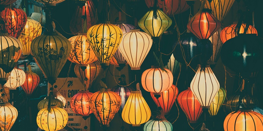 White and red paper lanterns hanging in rows, creating a festive and cultural scene.