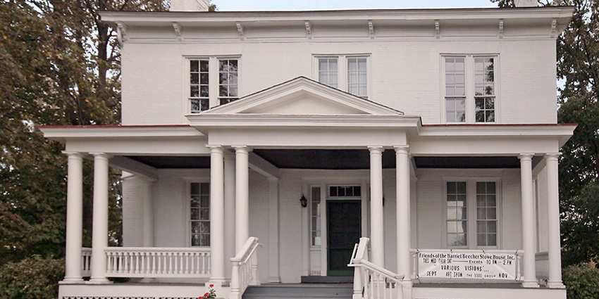 The Harriet Beecher Stowe House features a classic wooden home with green shutters
